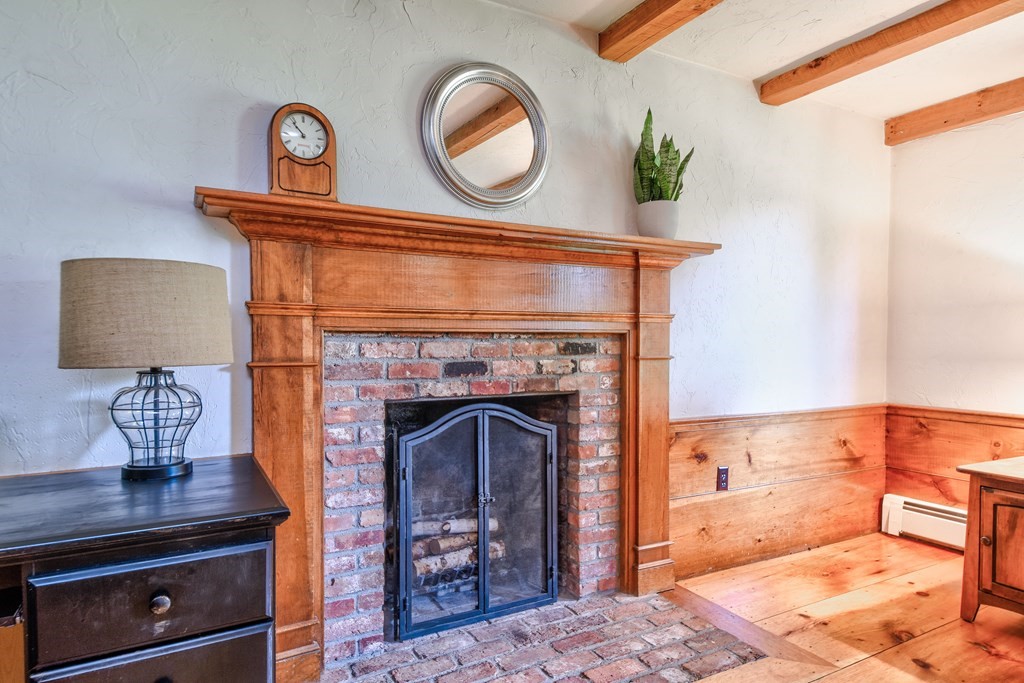 6 Dale Road Hopkinton, MA 01748 - Photo 10 of 39 a view of a livingroom with furniture and a fireplace