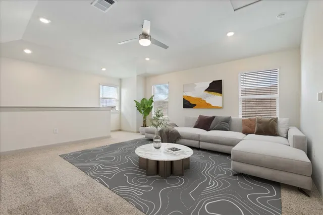 a living room with furniture and a large window