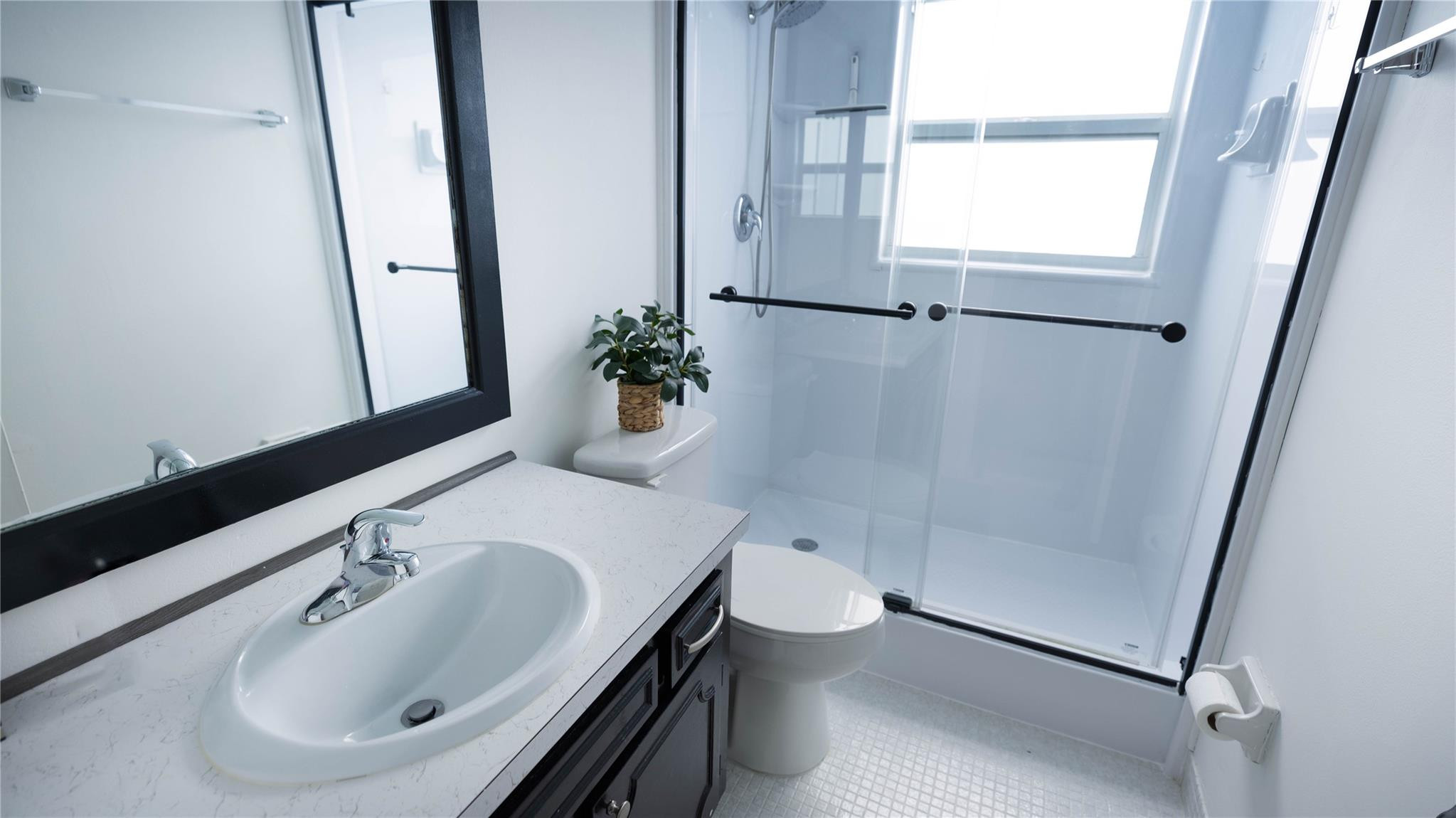 3100 North Course Lane, Unit 510 Pompano Beach, FL 33069 - Photo 17 of 21 a bathroom with a sink and a mirror