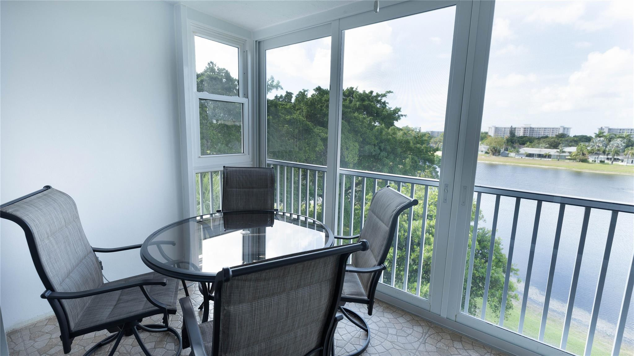 3100 North Course Lane, Unit 510 Pompano Beach, FL 33069 - Photo 2 of 21 a balcony view with a seating space