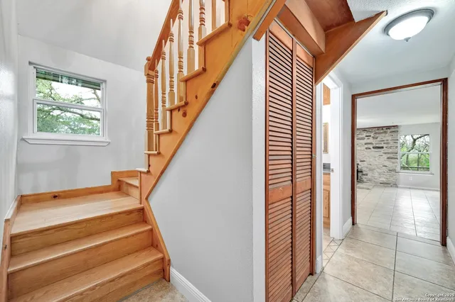 a view of entryway and hall with wooden floor