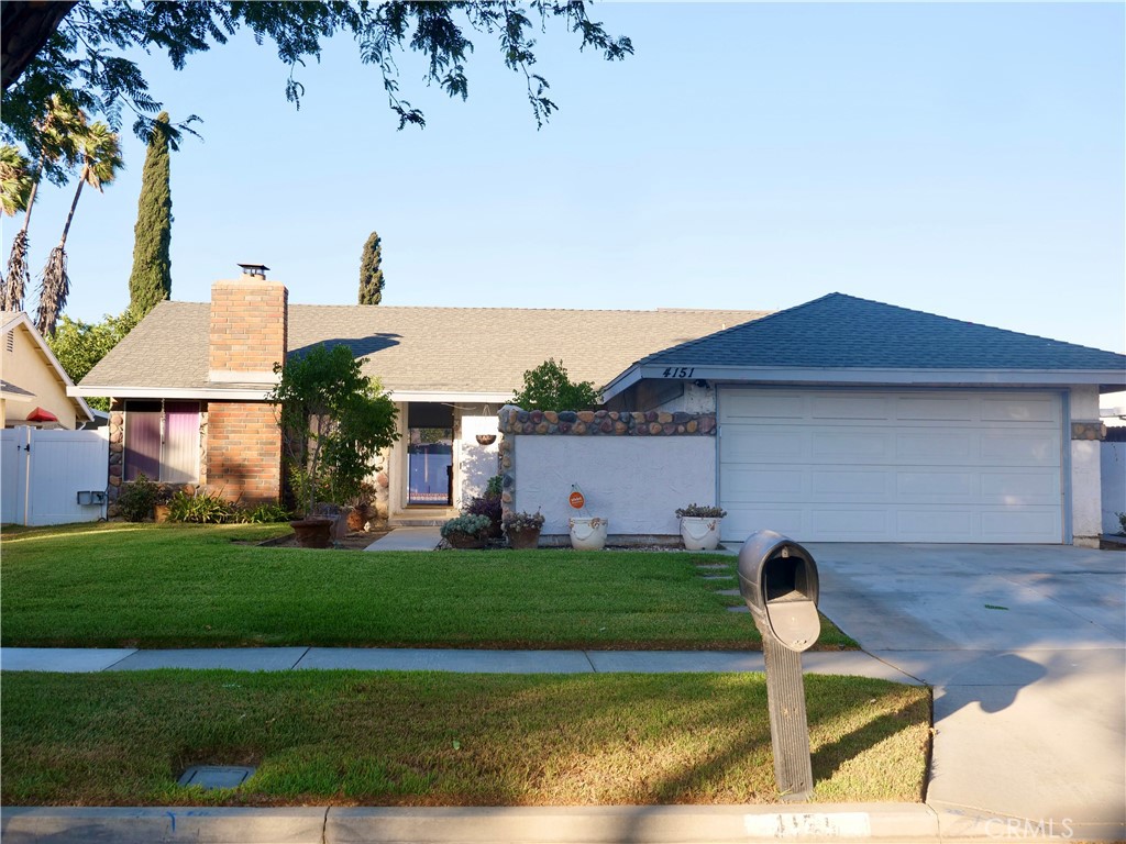 4151 Lockhaven Lane Riverside, CA 92505 - Photo 1 of 1 a front view of a house with garden