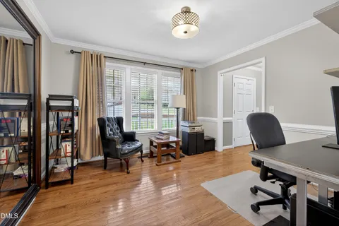 a living room with furniture rug and a window