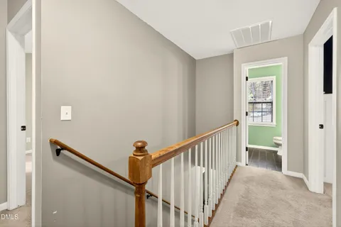 a view of a hallway with windows