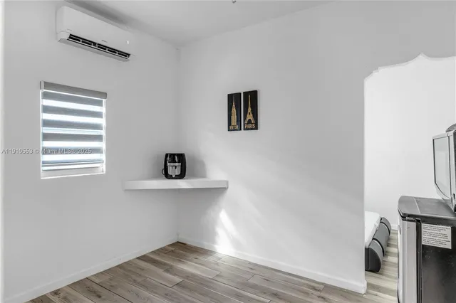 a view of entryway with wooden floor