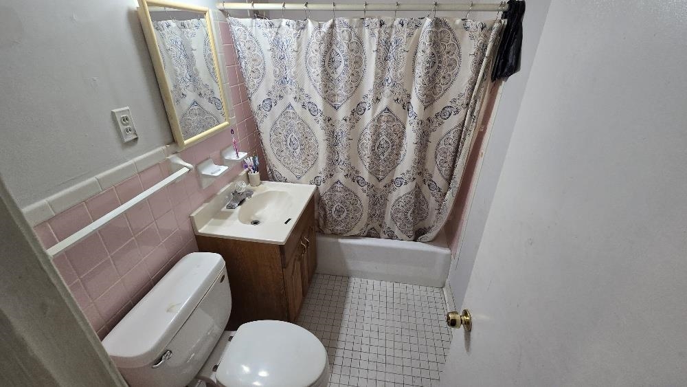 3162 Ford Road Memphis, TN 38109 - Photo 7 of 17 a bathroom with a sink and toilet