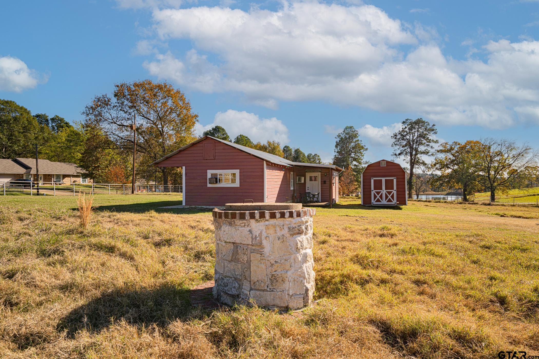 1855 Phillips Springs Road Gladewater, TX 75647 - Photo 35 of 36 a front view of a house with a yard covered with snow