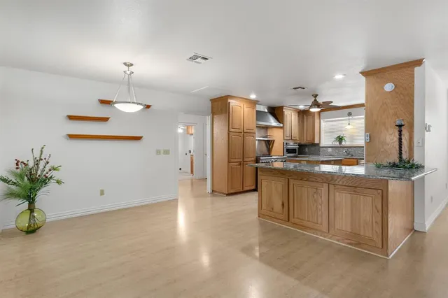 a large kitchen with lots of counter space and appliances