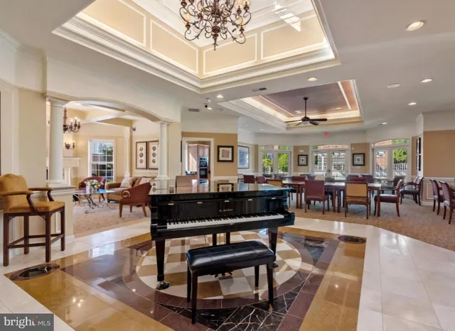 a living room with lots of furniture a rug and white walls