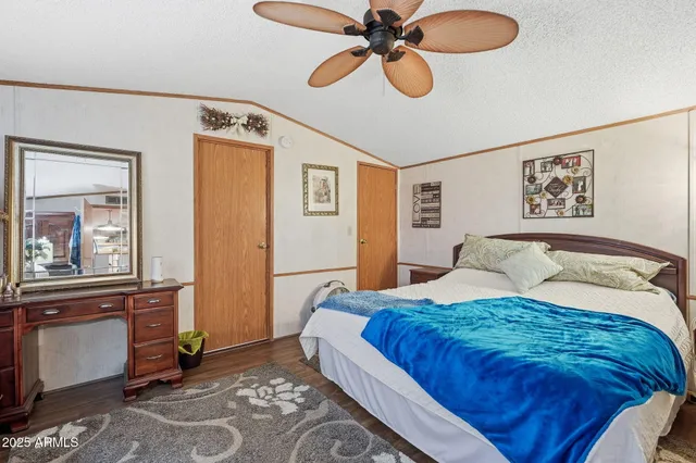 a bedroom with a bed and cabinets