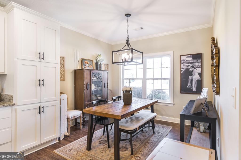 609 Live Oak Way Dublin, GA 31021 - Photo 17 of 37 a view of a dining room with furniture window and wooden floor
