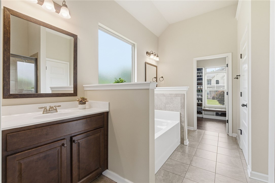 138 Buckland Drive Anderson, SC 29621 - Photo 24 of 49 This primary bathroom features a double vanity, soaking tub, and tile flooring, offering a serene retreat.