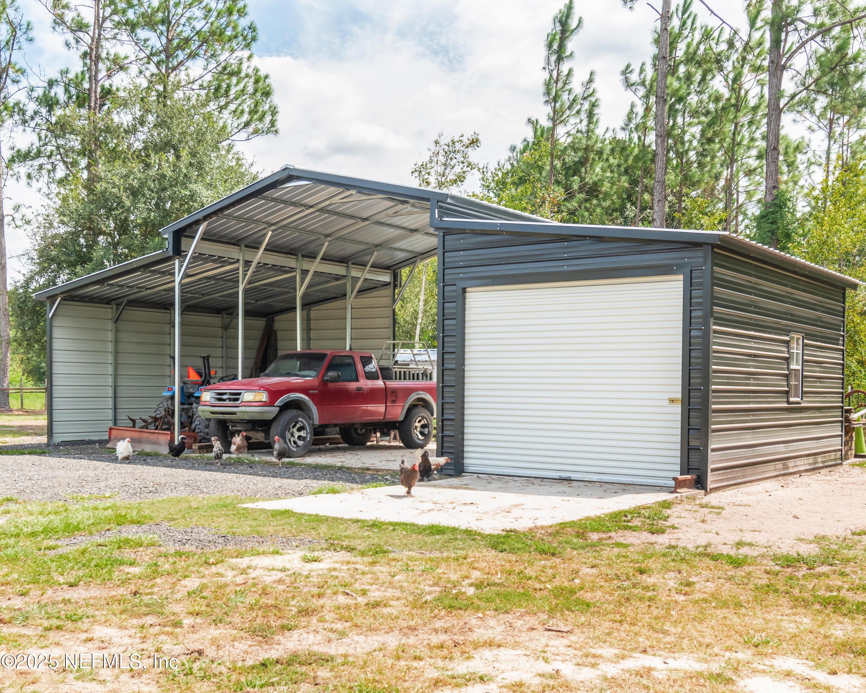 9100 Mud Lake Road Macclenny, FL 32063 - Photo 10 of 25 a view of a house with a patio and a yard