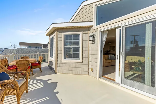 a blue and white building with glass windows