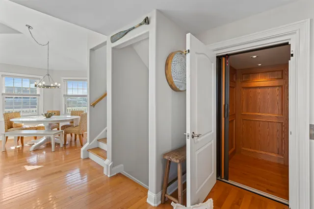 a view of a livingroom with furniture and hardwood floor