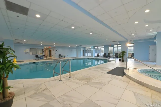 a view of swimming pool and a potted plant