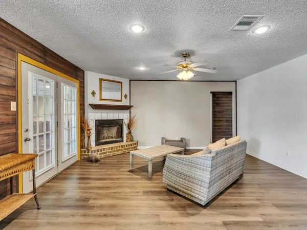 a living room with furniture and a fireplace