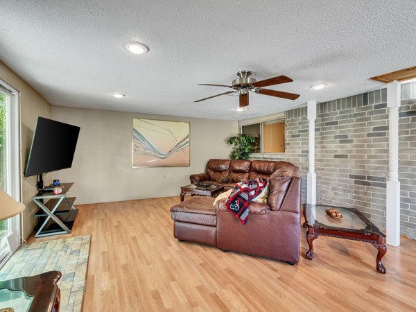 634 Bright Penny Lane Houston, TX 77015 - Photo 15 of 24 a living room with furniture and a flat screen tv