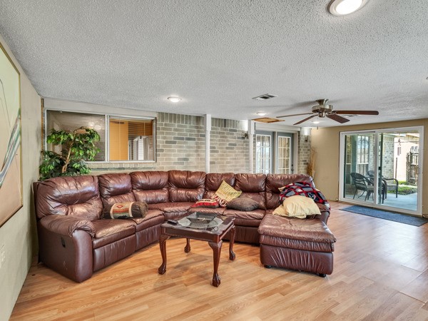 634 Bright Penny Lane Houston, TX 77015 - Photo 17 of 24 a living room with furniture and wooden floor