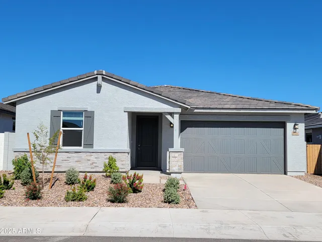a front view of a house with a garage
