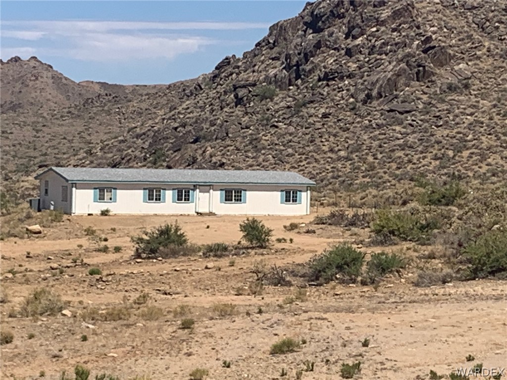 4745 Smoketree Road Golden Valley, AZ 86413 - Photo 1 of 33 a front view of a house with a yard