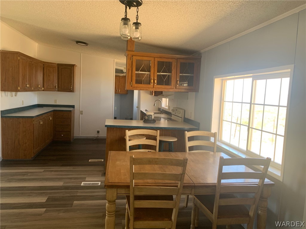 4745 Smoketree Road Golden Valley, AZ 86413 - Photo 11 of 33 a kitchen with a stove a sink and cabinets
