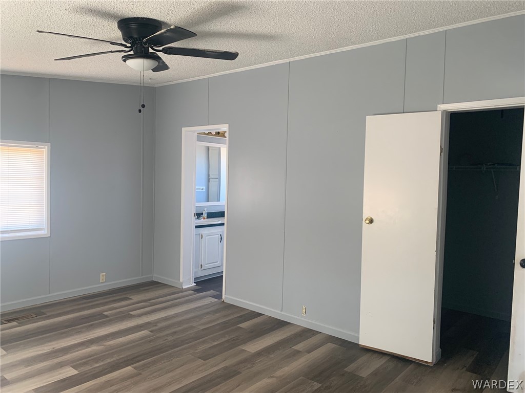 4745 Smoketree Road Golden Valley, AZ 86413 - Photo 16 of 33 a view of an empty room with a ceiling fan