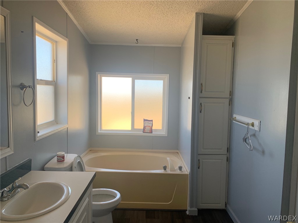 4745 Smoketree Road Golden Valley, AZ 86413 - Photo 17 of 33 a bathroom with a sink toilet and shower