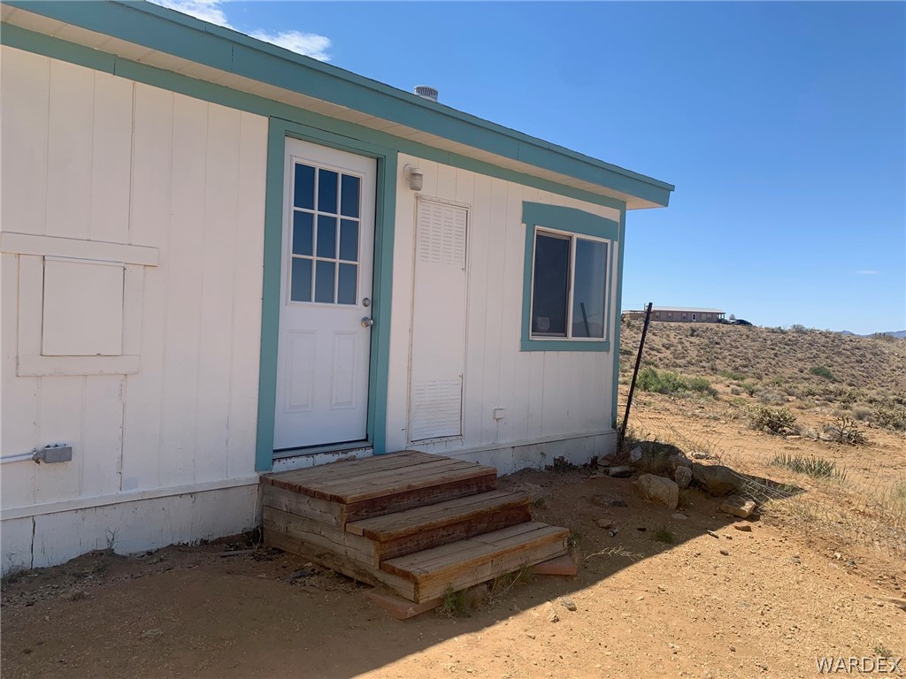 4745 Smoketree Road Golden Valley, AZ 86413 - Photo 24 of 33 a view of a house with a snow