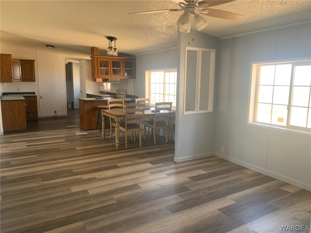 4745 Smoketree Road Golden Valley, AZ 86413 - Photo 10 of 33 a view of a kitchen with furniture and chandelier