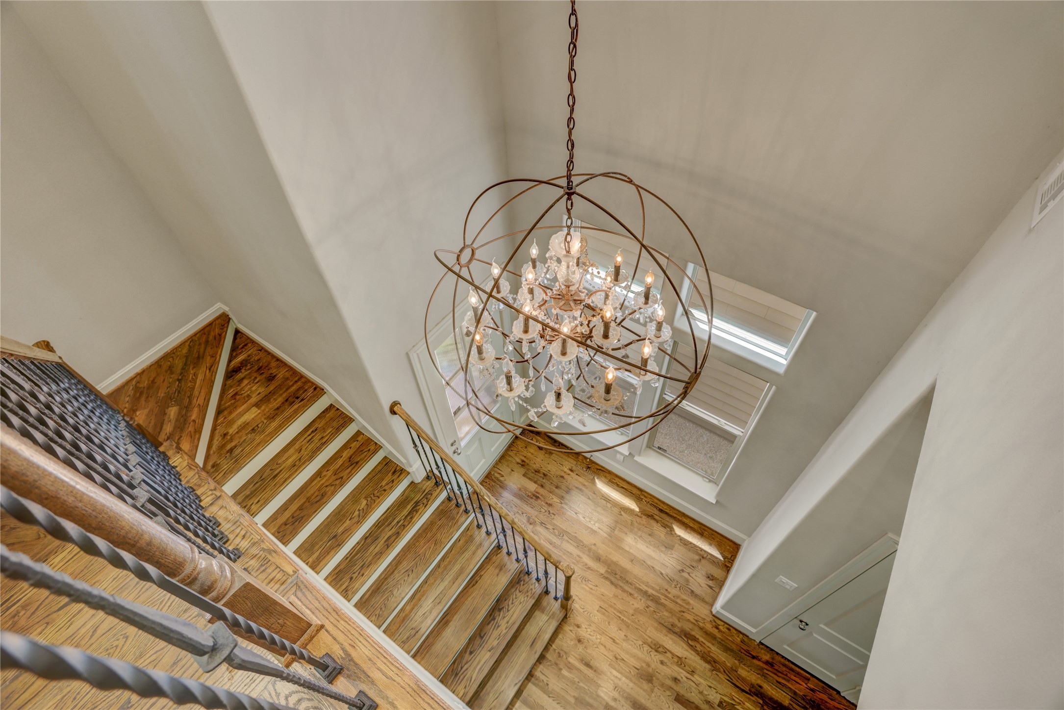 4124 Bonner View Lane Houston, TX 77007 - Photo 12 of 31 A view of the custom chandelier and staircase from the 2nd floor landing.