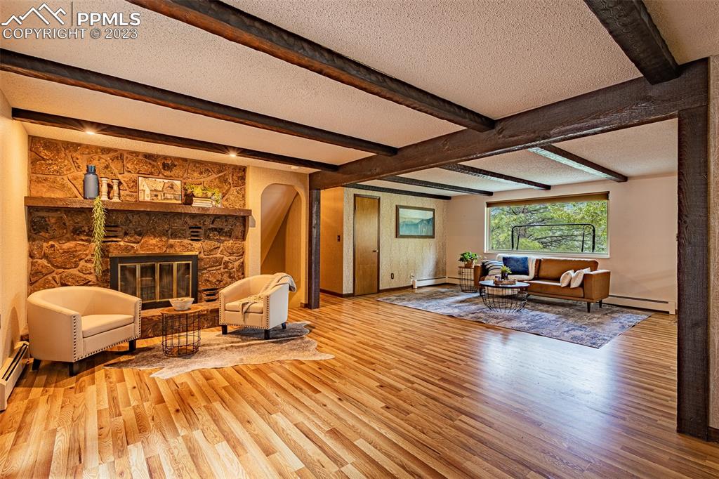 98 Button Rock Road Lyons, CO 80540 - Photo 12 of 49 a bedroom with furniture and a large window