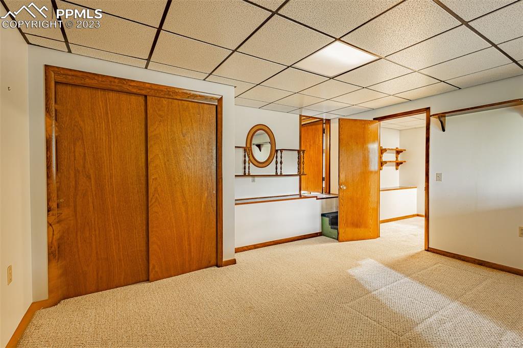 98 Button Rock Road Lyons, CO 80540 - Photo 21 of 49 a bedroom with a bed and a table