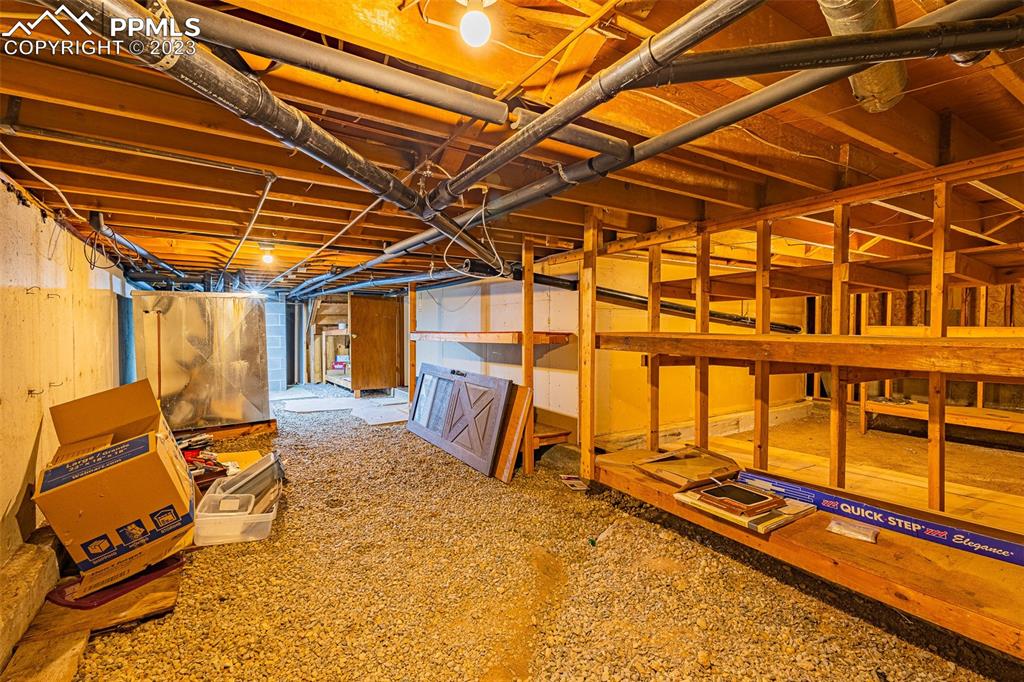 98 Button Rock Road Lyons, CO 80540 - Photo 31 of 49 a view of a backyard with furniture and floor to ceiling window