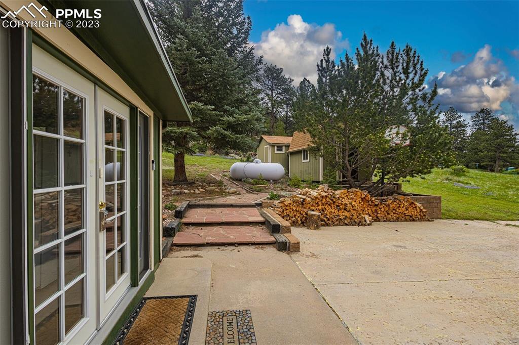 98 Button Rock Road Lyons, CO 80540 - Photo 35 of 49 a view of a porch with furniture and a pathway