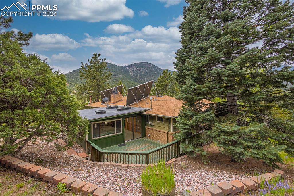 98 Button Rock Road Lyons, CO 80540 - Photo 43 of 49 a view of a chairs and table in the patio