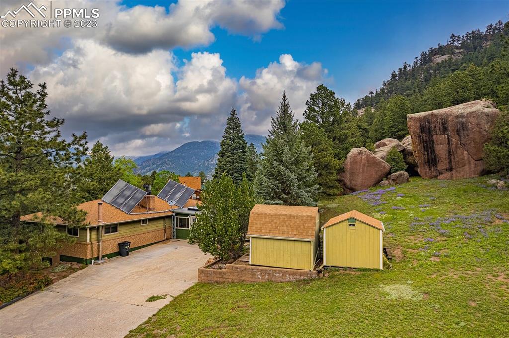 98 Button Rock Road Lyons, CO 80540 - Photo 47 of 49 a white house with a yard