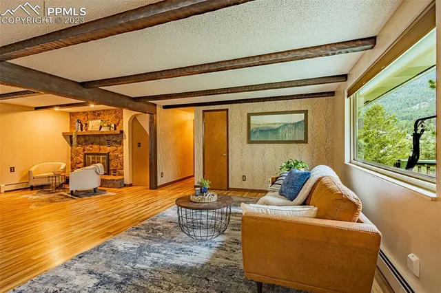 a living room with furniture and a large window