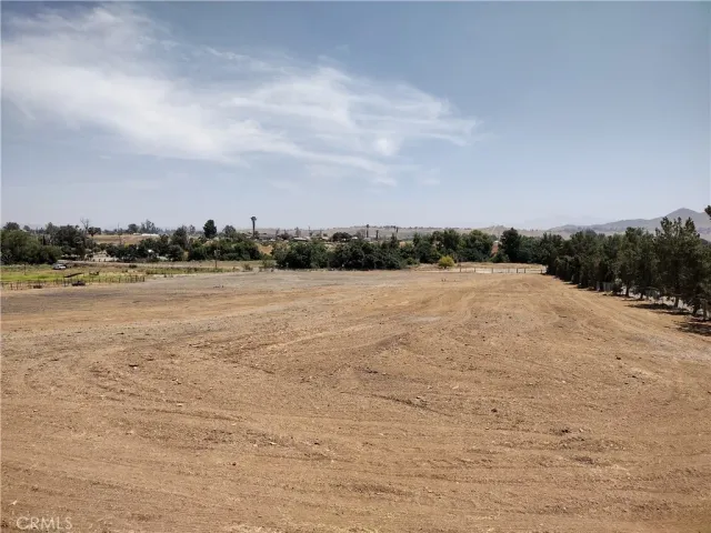 a view of a road and mountains in the background