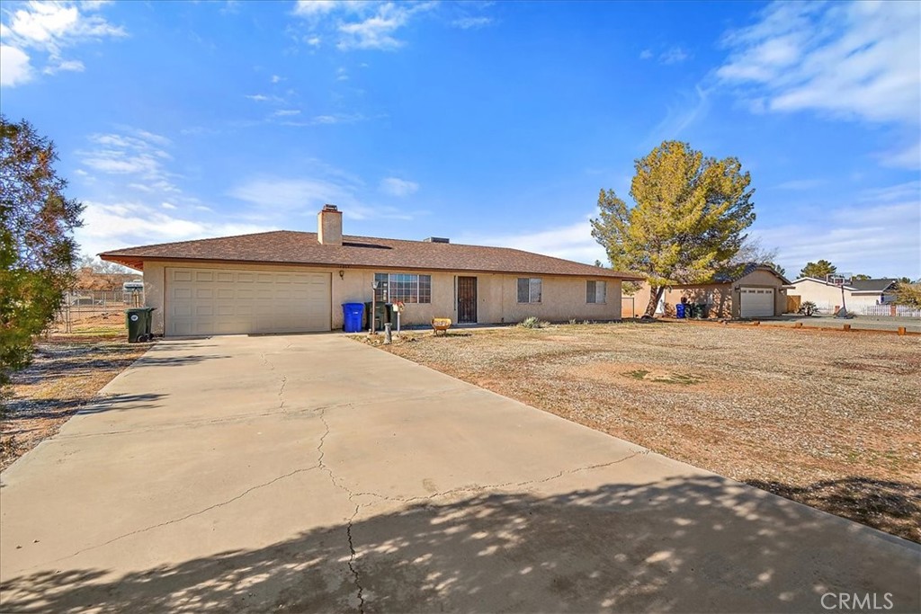 14962 Temecula Road Apple Valley, CA 92307 - Photo 1 of 1 a view of garage with a house