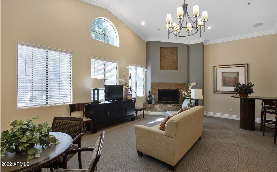 2025 East Campbell Avenue, Unit 238 Phoenix, AZ 85016 - Photo 11 of 18 a living room with furniture chandelier and a fireplace