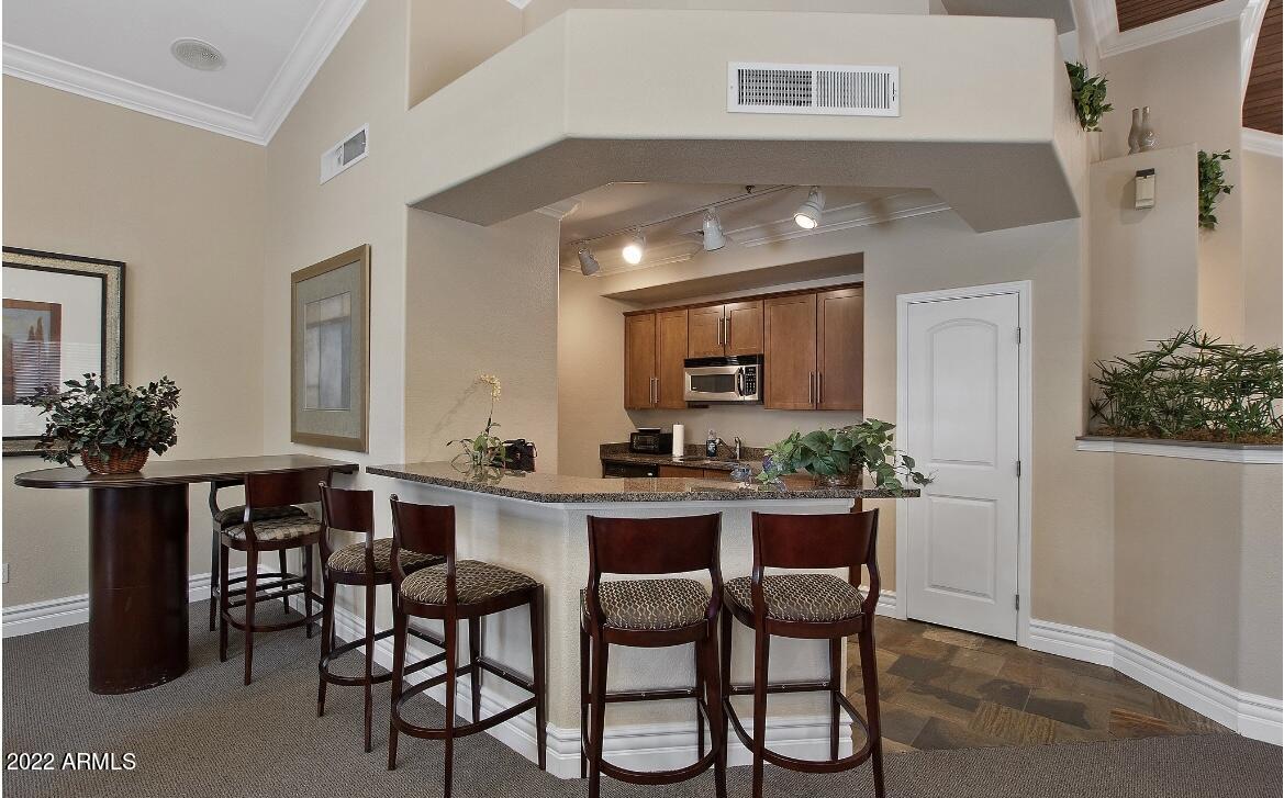 2025 East Campbell Avenue, Unit 238 Phoenix, AZ 85016 - Photo 12 of 18 a view of a dining room with furniture and window