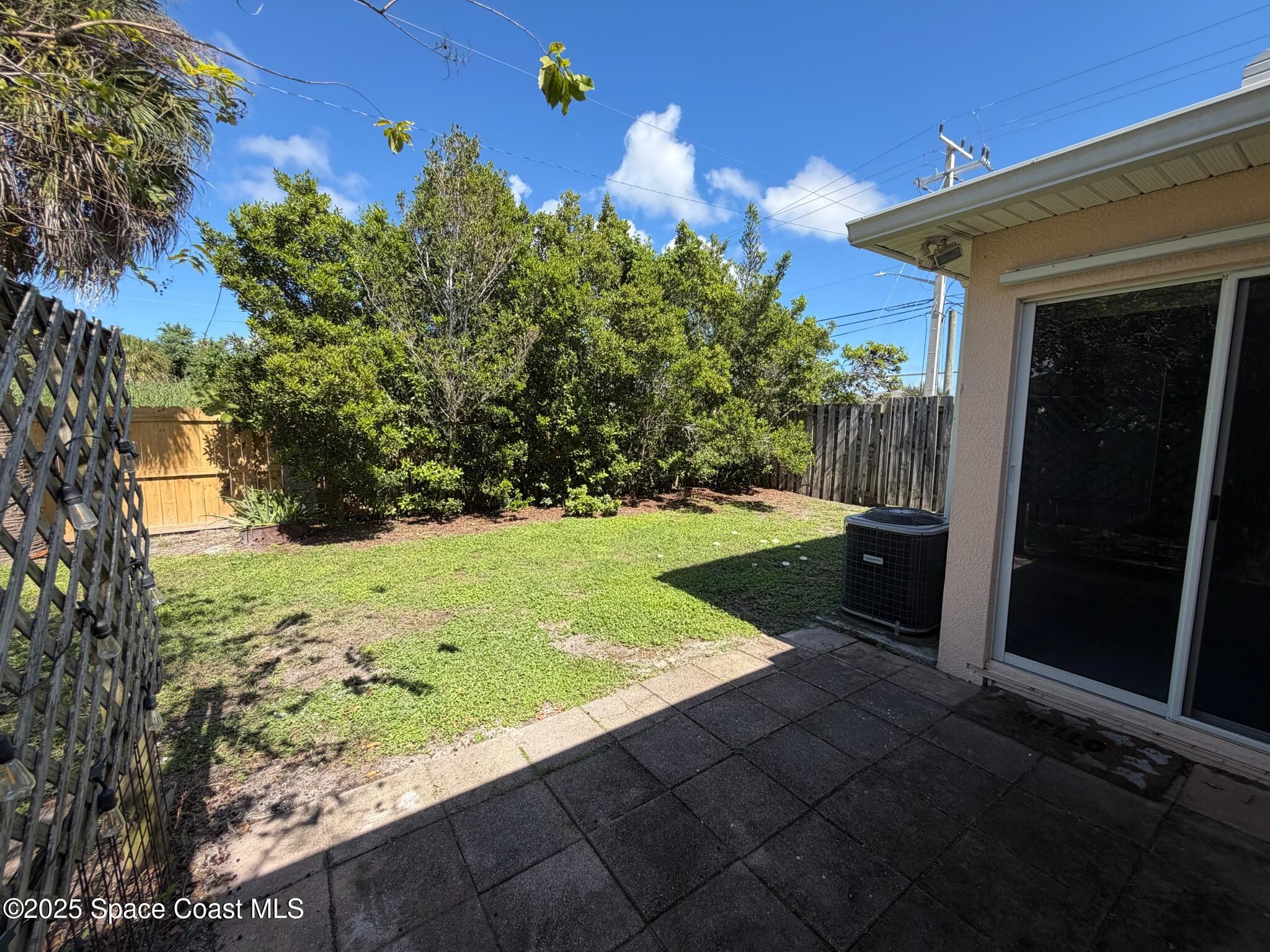 1626 Mason Terrace Melbourne, FL 32935 - Photo 24 of 24 a view of a backyard with wooden fence