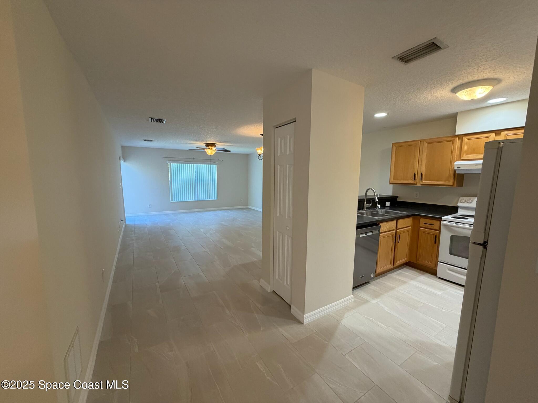 1626 Mason Terrace Melbourne, FL 32935 - Photo 4 of 24 a view of a kitchen with a sink