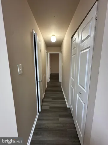 a kitchen with a refrigerator and a stove top oven