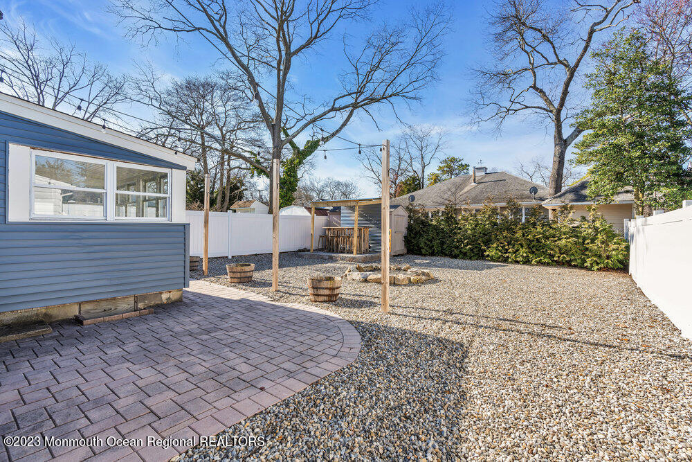 28 Pinehurst Road Brick, NJ 08723 - Photo 34 of 40 a view of a backyard with large trees