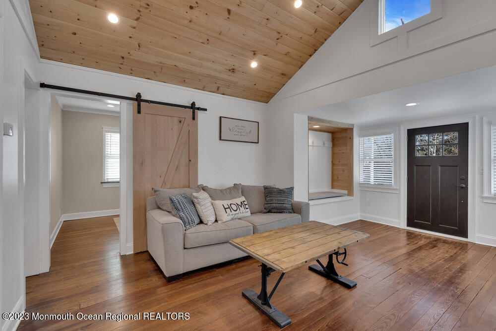 28 Pinehurst Road Brick, NJ 08723 - Photo 7 of 40 a living room with furniture and wooden floor
