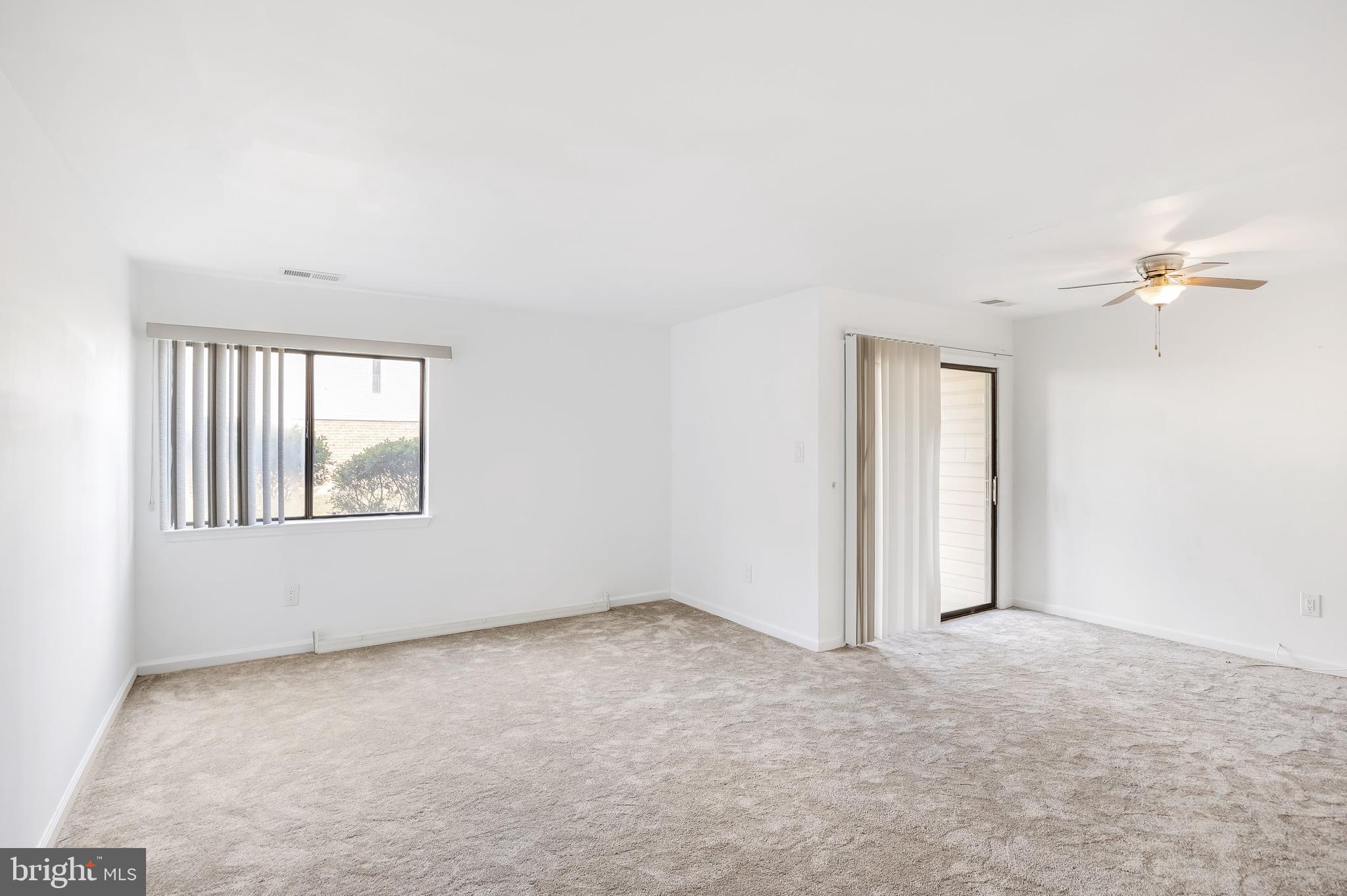 1801 Egg Harbor Road, Unit 105 Clementon, NJ 08021 - Photo 3 of 23 Living room and sliders to patio