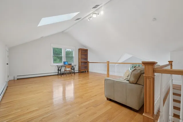 a view of a livingroom with furniture and cabinets