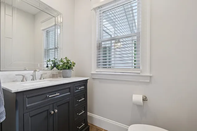 a view of kitchen with sink and wooden floor